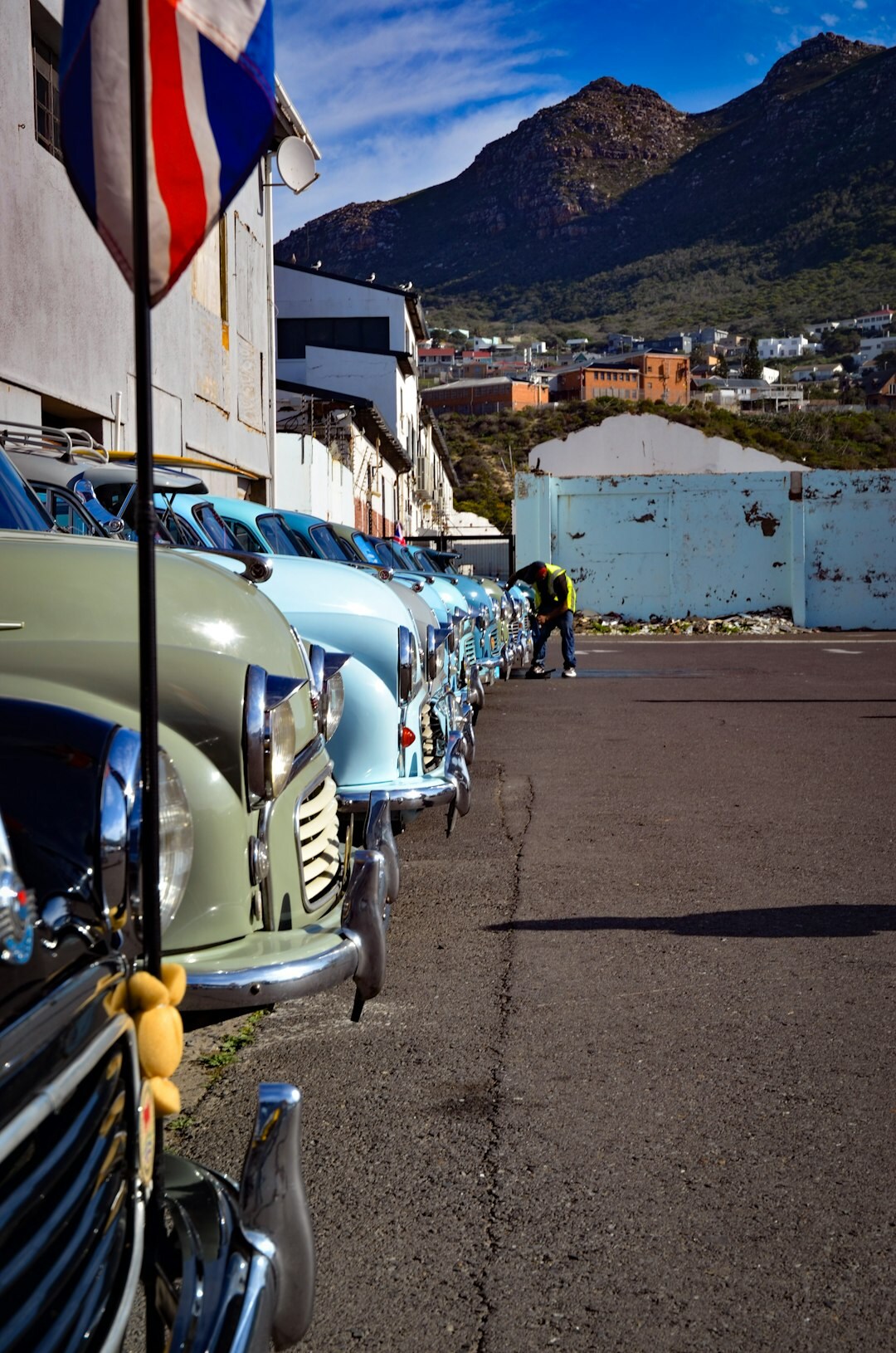 Classic car exhibition with rows of vintage automobiles near the coast
