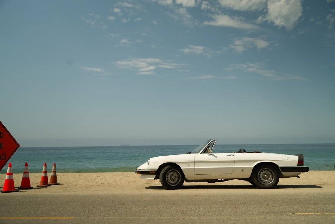 Convertible classic car parked near the beach in Punta del Este during summer