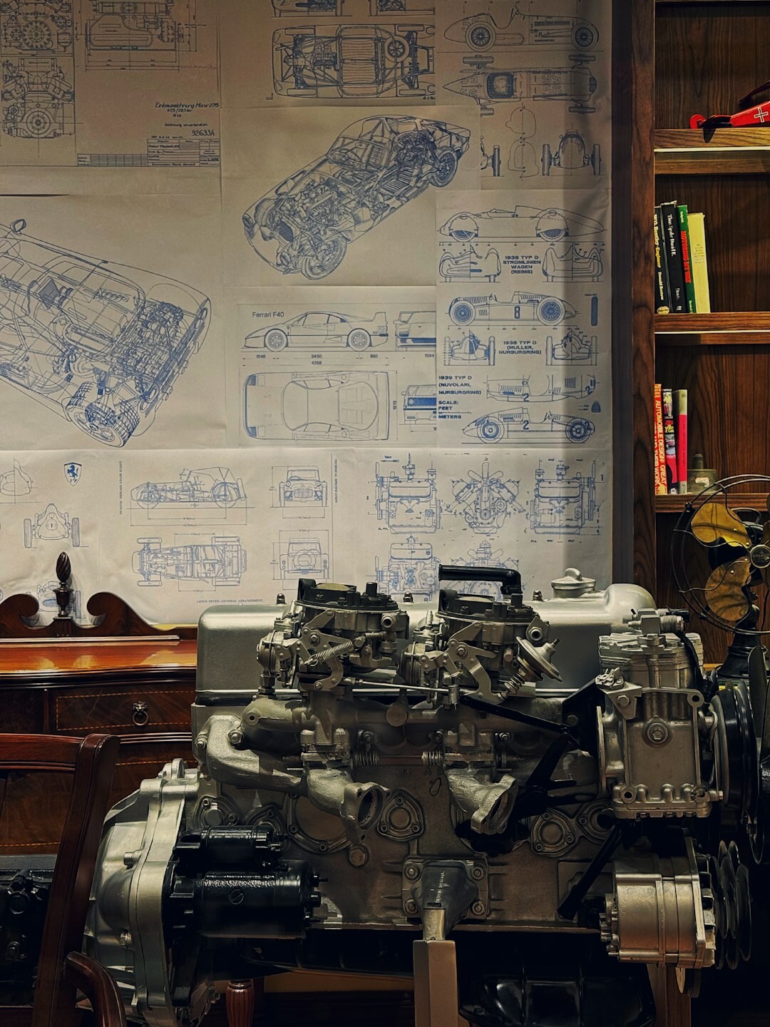 Vintage automobile design sketch on a drafting table with a scale model