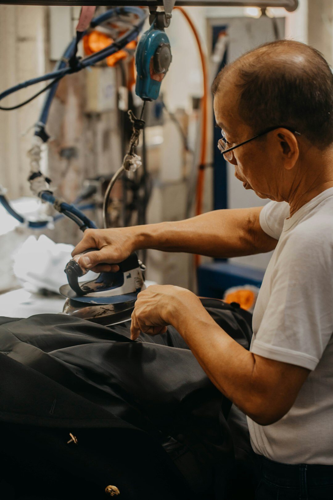man installing car seat cover