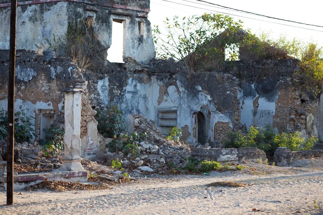 Old stone garage in Colonia del Sacramento with a restored classic car